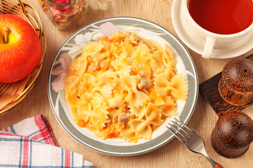 Italian pasta - farfalle with chicken and tomato sauce  