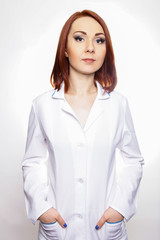 Woman doctor, nurse in white lab coat with phonendoscope isolated white background.