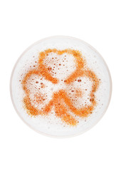 Glass of lager ale beer top with shamrock shape
