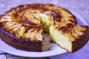 Baked cake cake apple pie covered with icing sugar