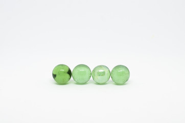 green marble on white background