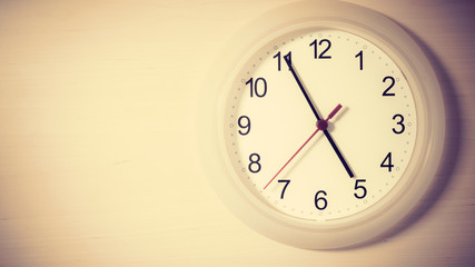 Clock ticking showing five hours