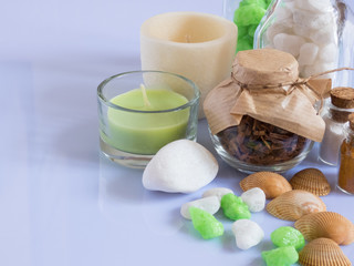 set ingredients and spice for aromatherapy and body care on a white surface with reflection. SPA still life