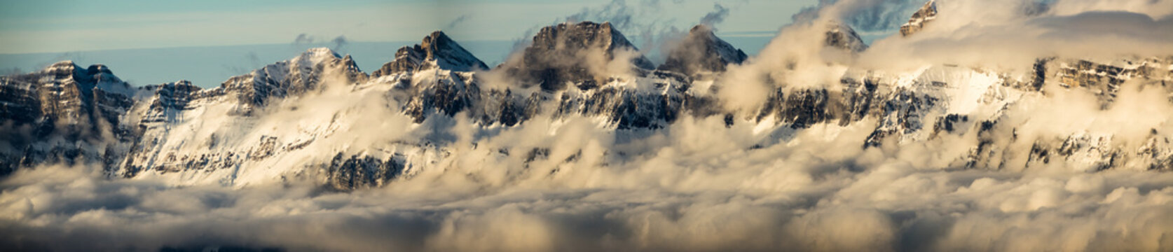 panorama view of the Churfirsten mountains in the Swiss Alps in winter with cloud banks