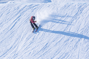 People are having fun in downhill skiing and snowboarding	