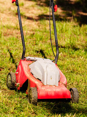 Fototapeta premium Gardening. Mowing lawn with lawnmower