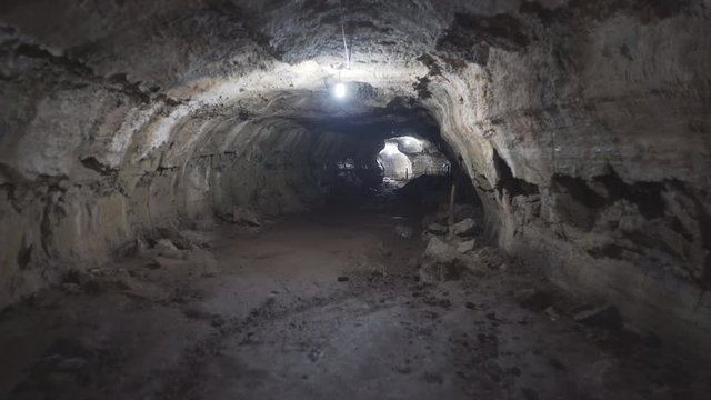 gimbal shot walking through a lava tube on isla santa cruz in the galapagos islands