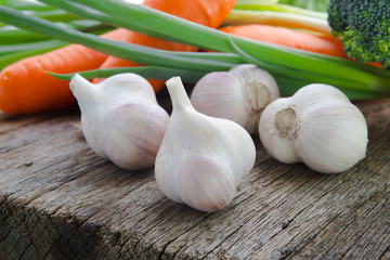 Organic vegetables, healthy food, fresh vegetables and ingredients on the table in the wood, mushrooms, garlic, etc.