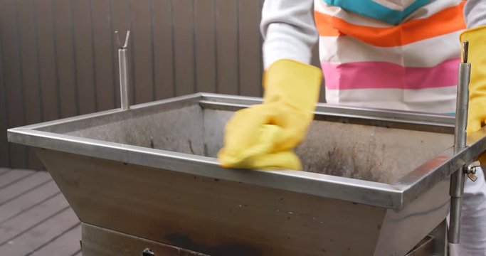 Cleaning of barbecue oven at outdoor