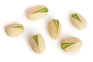 Pistachios isolated on white background, top view. Flat lay