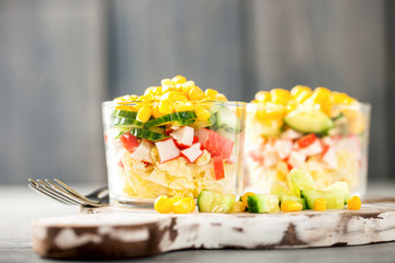 Salad with crab sticks,  corn and fresh cucumber