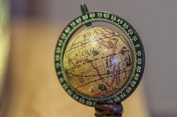 Obraz na płótnie Canvas Close-up on a small globe with focus on Africa