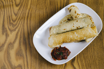 rolled pancake with spicy sauce (malaysian delicacies)