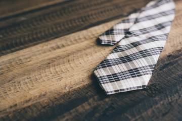 tie / necktie on a wooden background. fashion concept. tie day