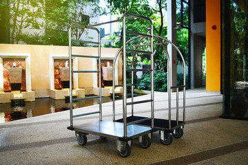 Empty hotel baggage cart in the hotel background or Empty bellman's luggage cart