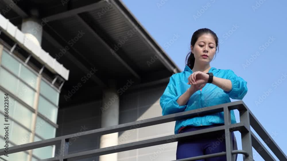 Wall mural runner looking sport watch