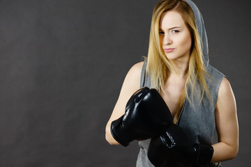 Boxer girl exercise with boxing gloves.