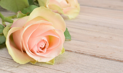 Pink rose on old desk
