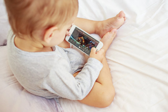 Child watching video on mobile phone