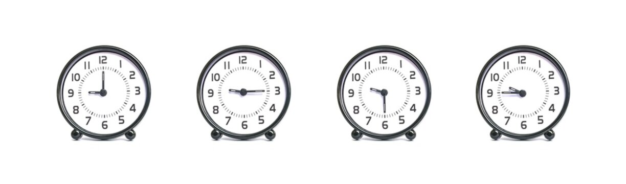 Closeup group of black and white clock show the time in 9 , 9:15 , 9:30 , 9:45 a.m. isolated on white background