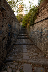 A narrow street of italy with steps of stone. Monselice, Italy.