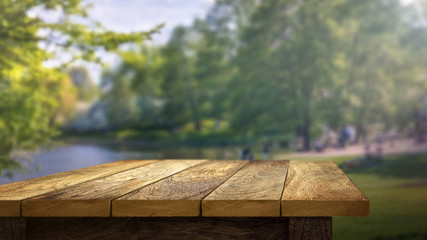 Wooden Table outside in park background