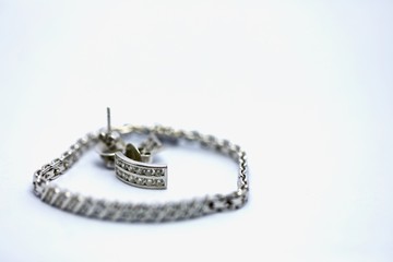 Earrings and bracelets are a couple of accessories used by women.