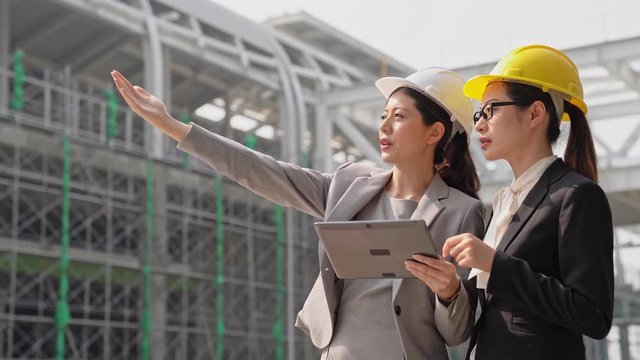 engineers discussion using digital tablet