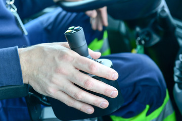 Obraz na płótnie Canvas Emergency personnel - hand of a man on his joystick