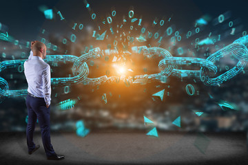 Businessman in front of a wall with Weak link of a Broken blockchain exploding - 3d render