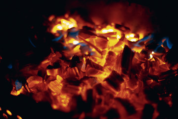 Wooden coils and fire in the grill.