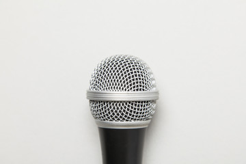 microphone on a plain grey background.
