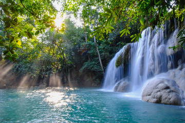 Fototapeta na wymiar Erawan waterfall with sunlight in the morning , Kanchanaburi Province, Thailand.
