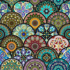 Colorful floral seamless pattern from circles with mandala in patchwork boho chic style