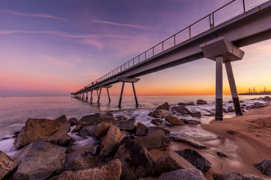 View of bridge over Mediterranean sea at sunset