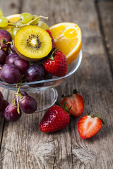Ripe fruits on a transparent plate