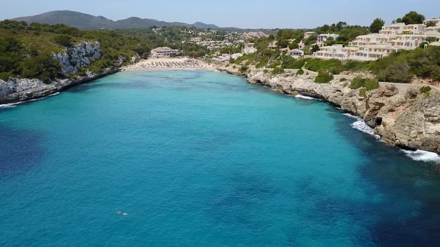 Drone aerial landscape of the beautiful bay of Cala Estany d'en Mas with a wonderful turquoise sea, Cala romantica, Porto Cristo, Majorca, Spain