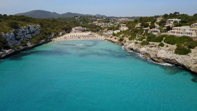 Drone aerial landscape of the beautiful bay of Cala Estany d'en Mas with a wonderful turquoise sea, Cala romantica, Porto Cristo, Majorca, Spain