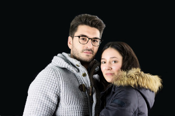 portrait of beautiful young couple in winter clothes