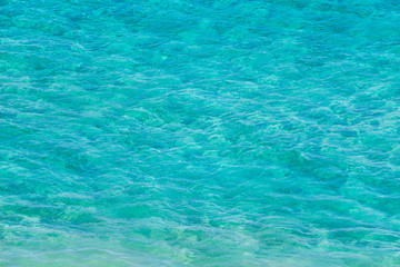 Fototapeta na wymiar Background pattern, perfect clear turquoise water from paradise.