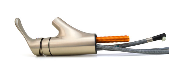 Plumbing water supply hose and faucet on white