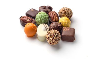 Delicious luxury chocolate candies on white background