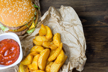 Fast food and a chilled glass of fresh light beer.