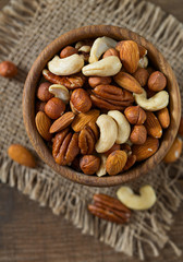 mixed nuts on wooden surface