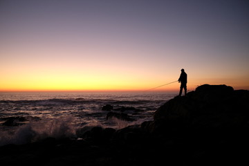 Obraz premium fisherman at sunset