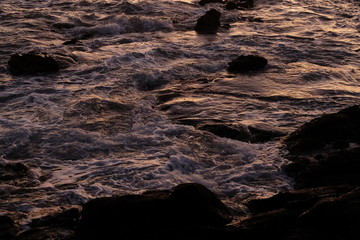 ocean among the rocks in the evening