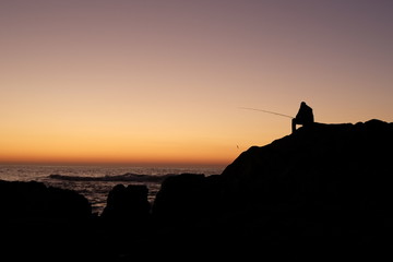 fisherman at sunset