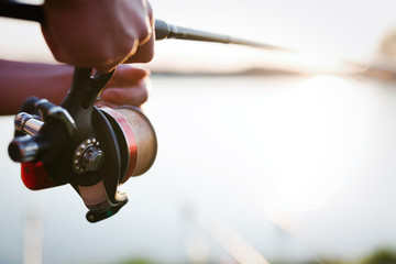 Fishing, hobby and recreational concept - fishermen