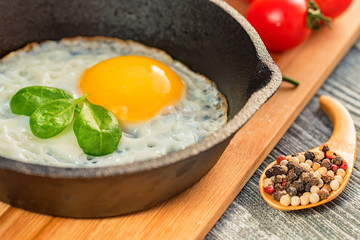 Fried eggs in a frying pan. Rustic breakfast