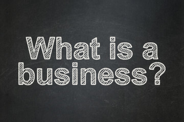 Business concept: text What is a Business? on Black chalkboard background